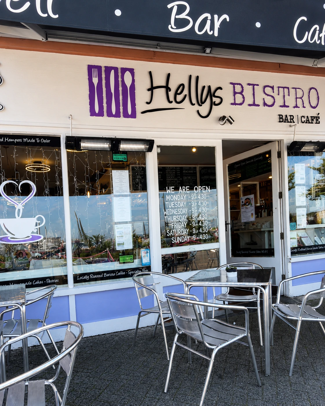 Hellys Bistro storefront with outdoor tables